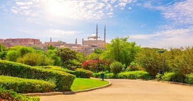 Panoramic view of Al-Azhar Park with landscaped gardens and Cairo skyline in the background
